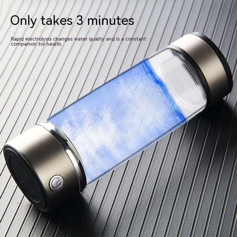 Hydrogen water bottle with visible water inside on a wooden surface