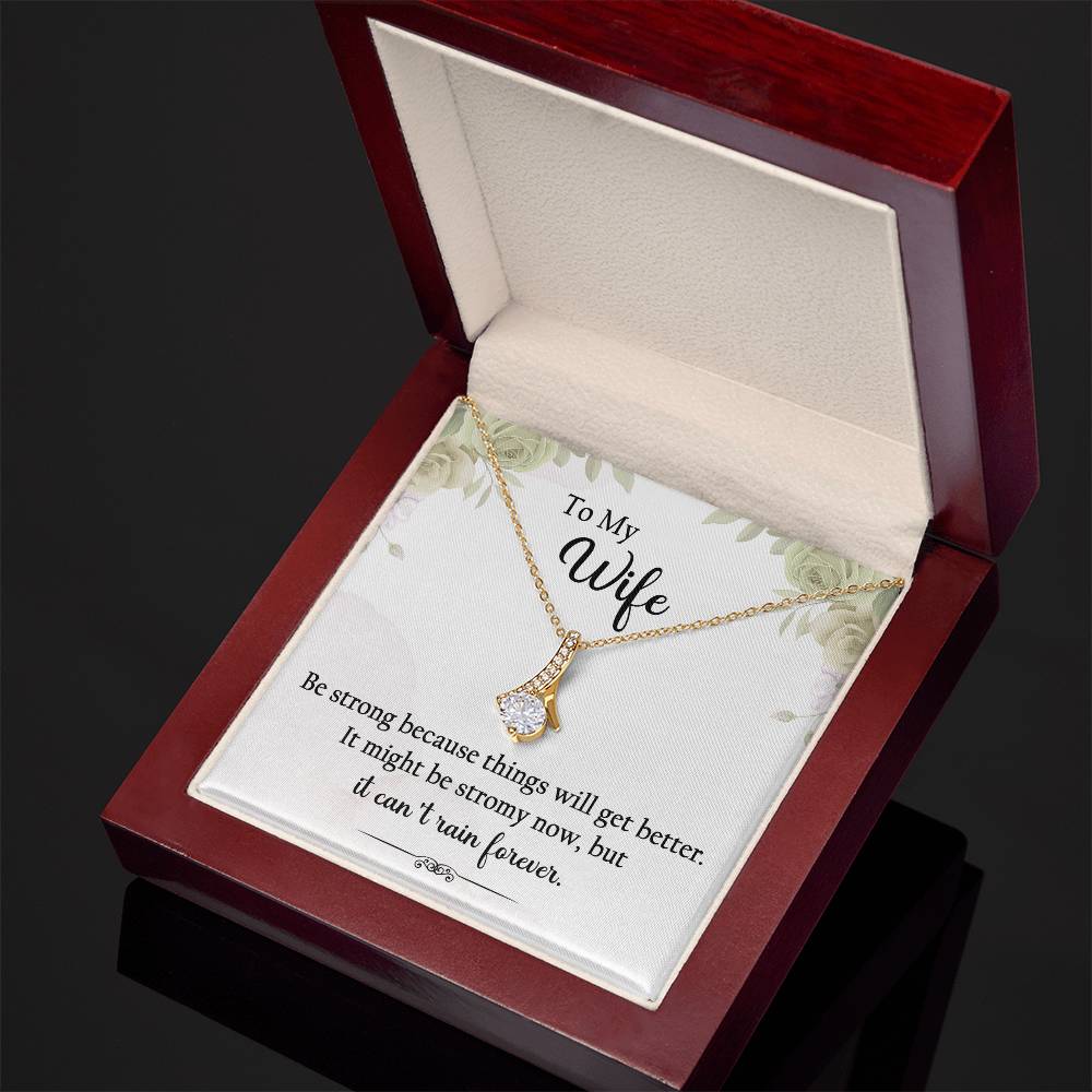 "To My Wife, Be strong because things will get better. It might be stormy now, but it can't rain forever." Alluring Beauty necklace, 14k white gold finish or 18k yellow gold finish over stainless steel. Shop now at Emporium Discounts A luxurious, yet affordable way to show your style. Enjoy the elegant craftsmanship and lasting quality of this beautiful necklace.